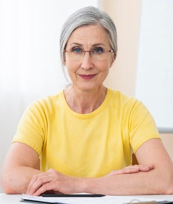 senior-woman-teaching-english-lessons_23-2149019830 (1)